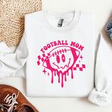 a white shirt with a pink football mom on it