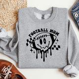 a sweatshirt that says football mom with a skull on it