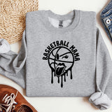 a sweatshirt with a basketball drawn on it