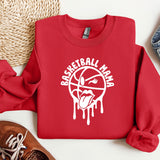 a red sweatshirt with white paint dripping down the side of it