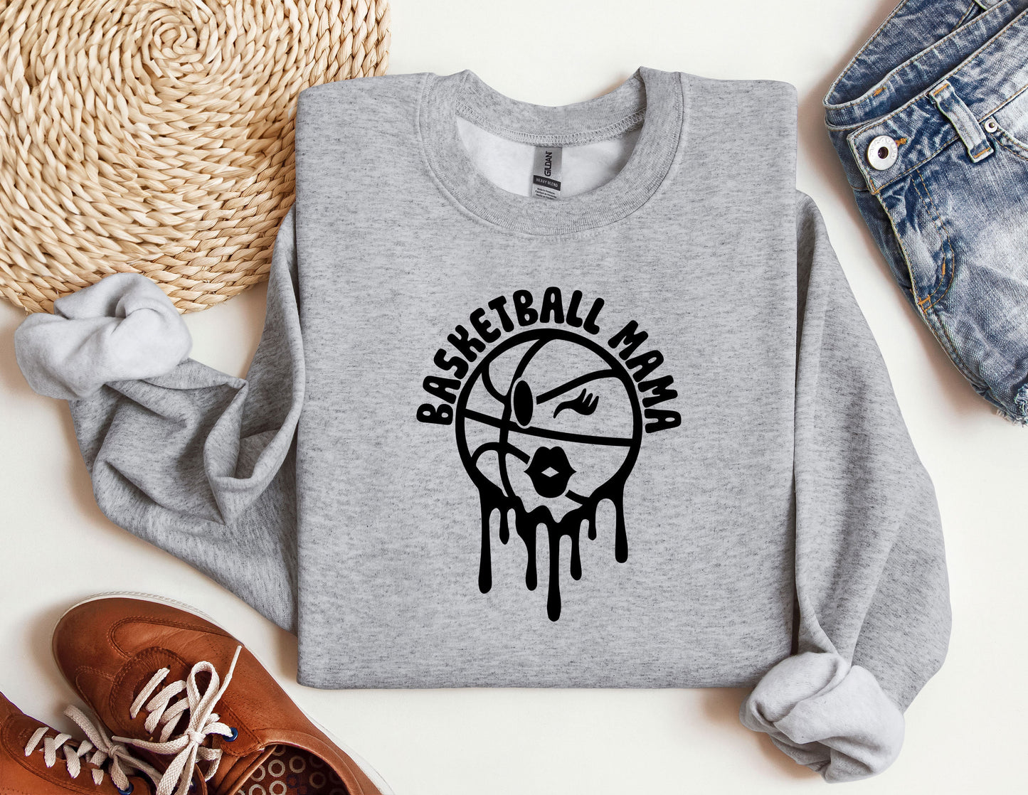 a sweatshirt with a basketball drawn on it