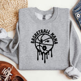 a sweatshirt with a basketball drawn on it