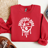 a red sweatshirt with a basketball drawn on it