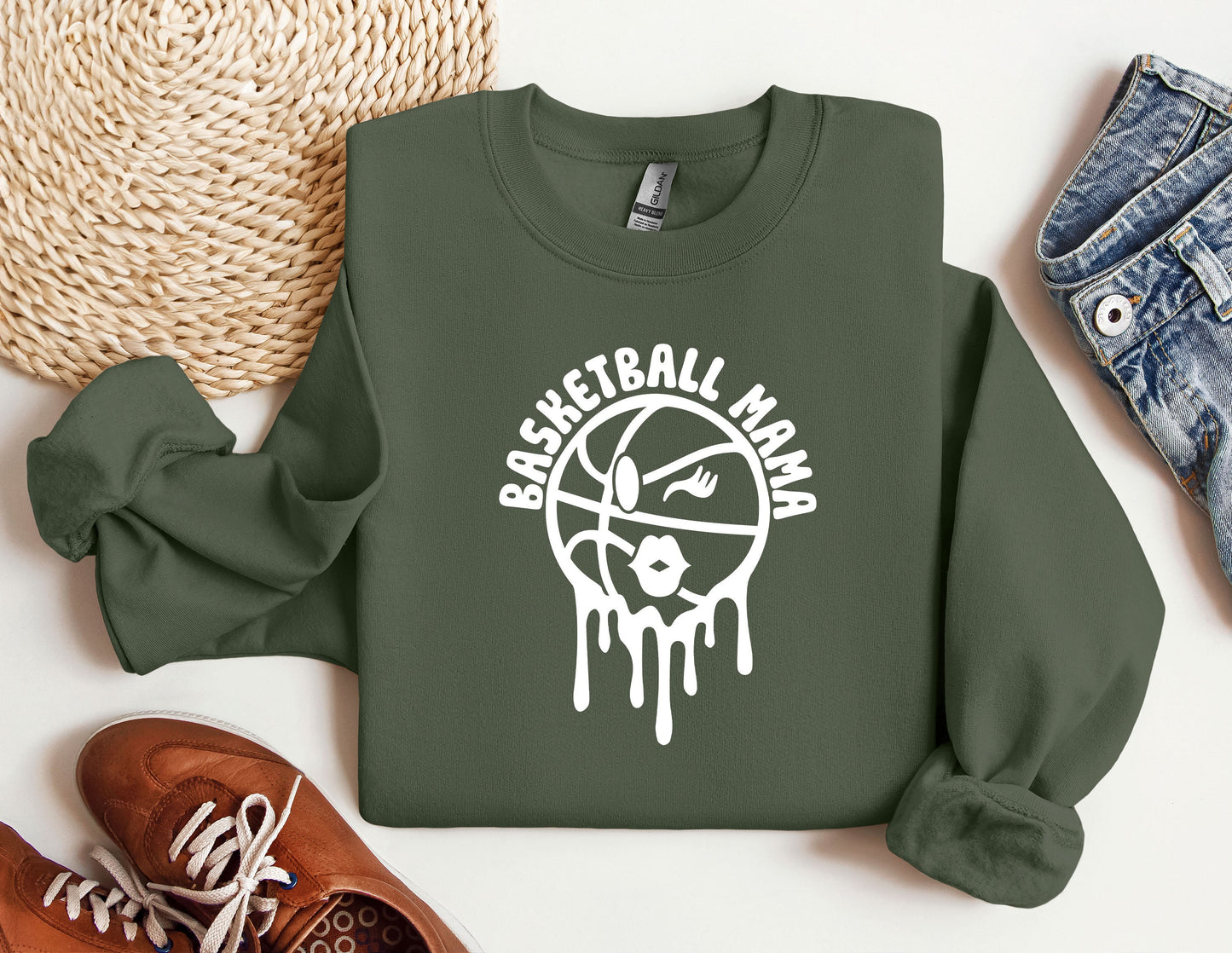 a green sweatshirt with a basketball drawn on it