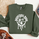 a green sweatshirt with a basketball drawn on it