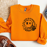 a pair of shoes and an orange sweatshirt