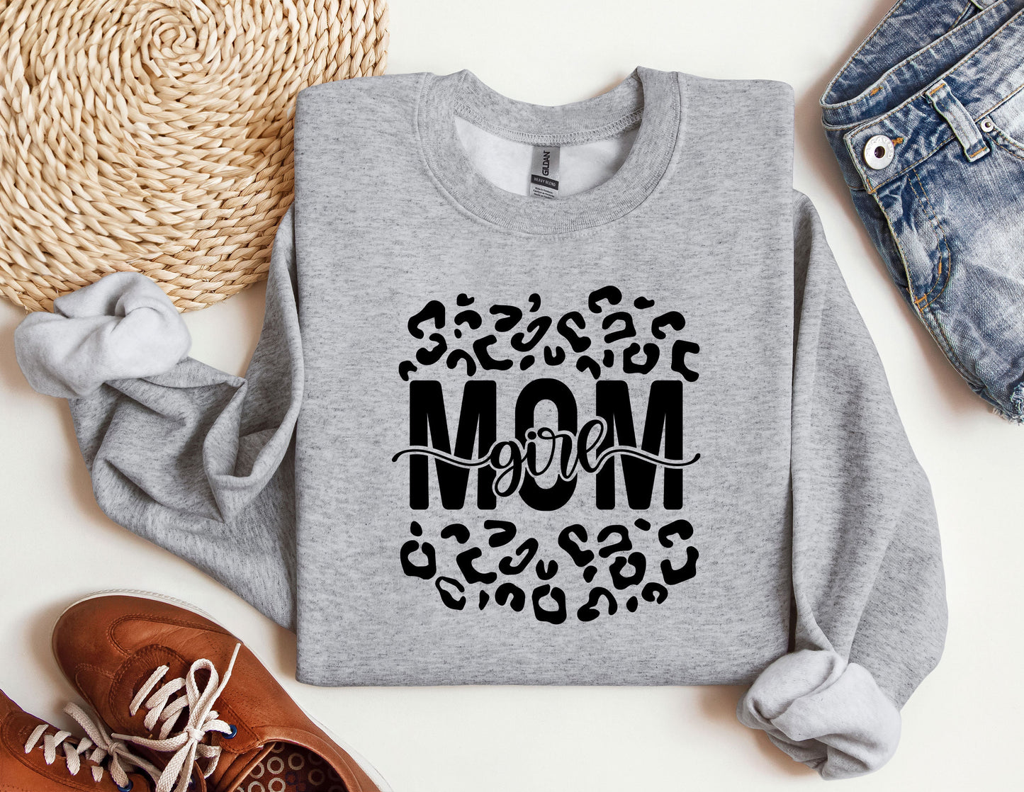 a sweatshirt with the word mom printed on it