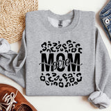 a sweatshirt with the word mom printed on it