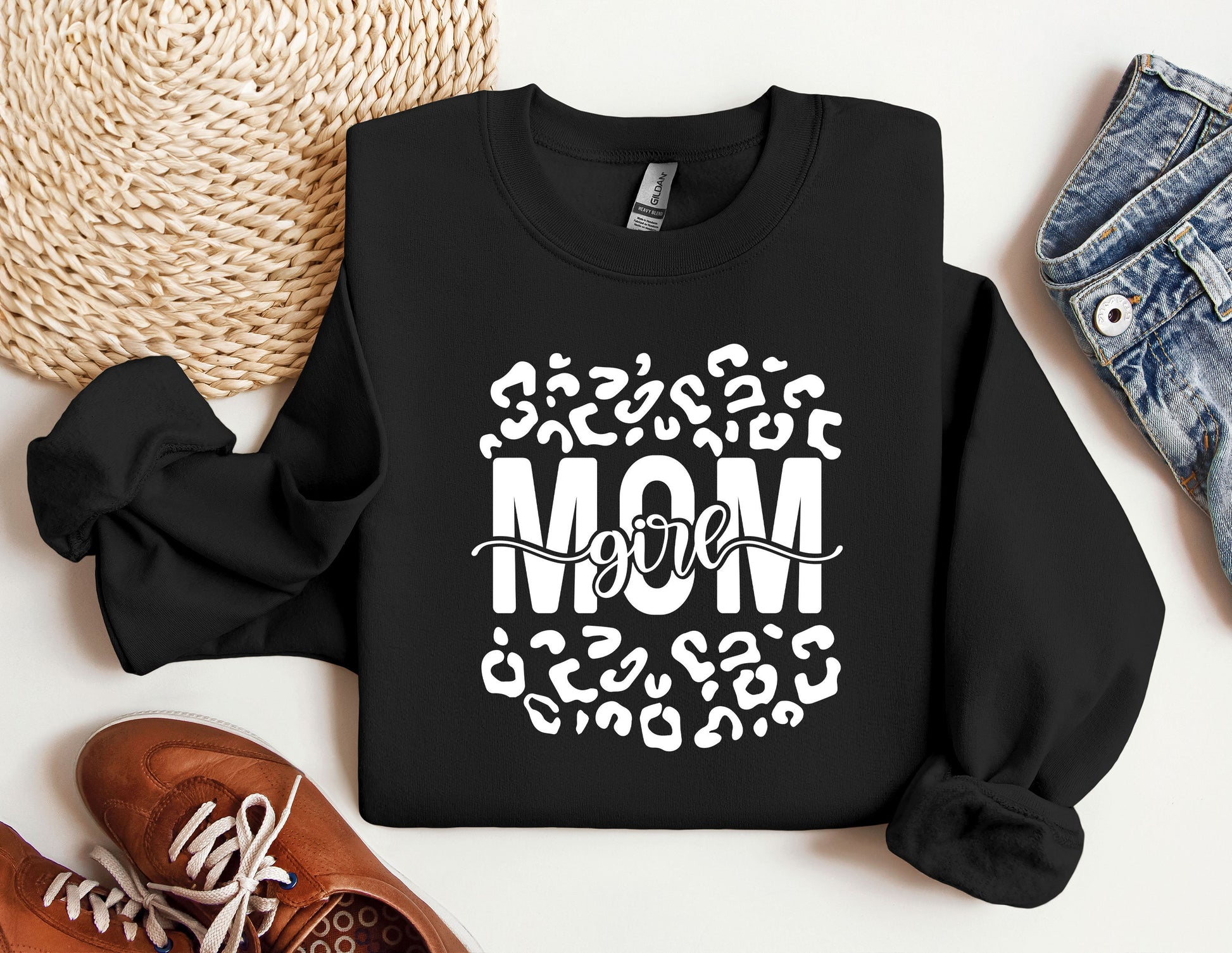 a black sweatshirt with the word mom printed on it