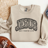 a sweater with the word jesus on it next to a pair of shoes
