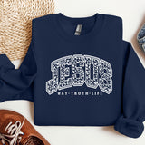 a blue sweatshirt with the word jesus on it next to a pair of sneakers