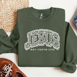 a sweatshirt with the word jesus on it next to a pair of shoes