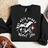 a black sweatshirt with a picture of a bat on it