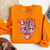 a pair of shoes and an orange shirt on a white surface