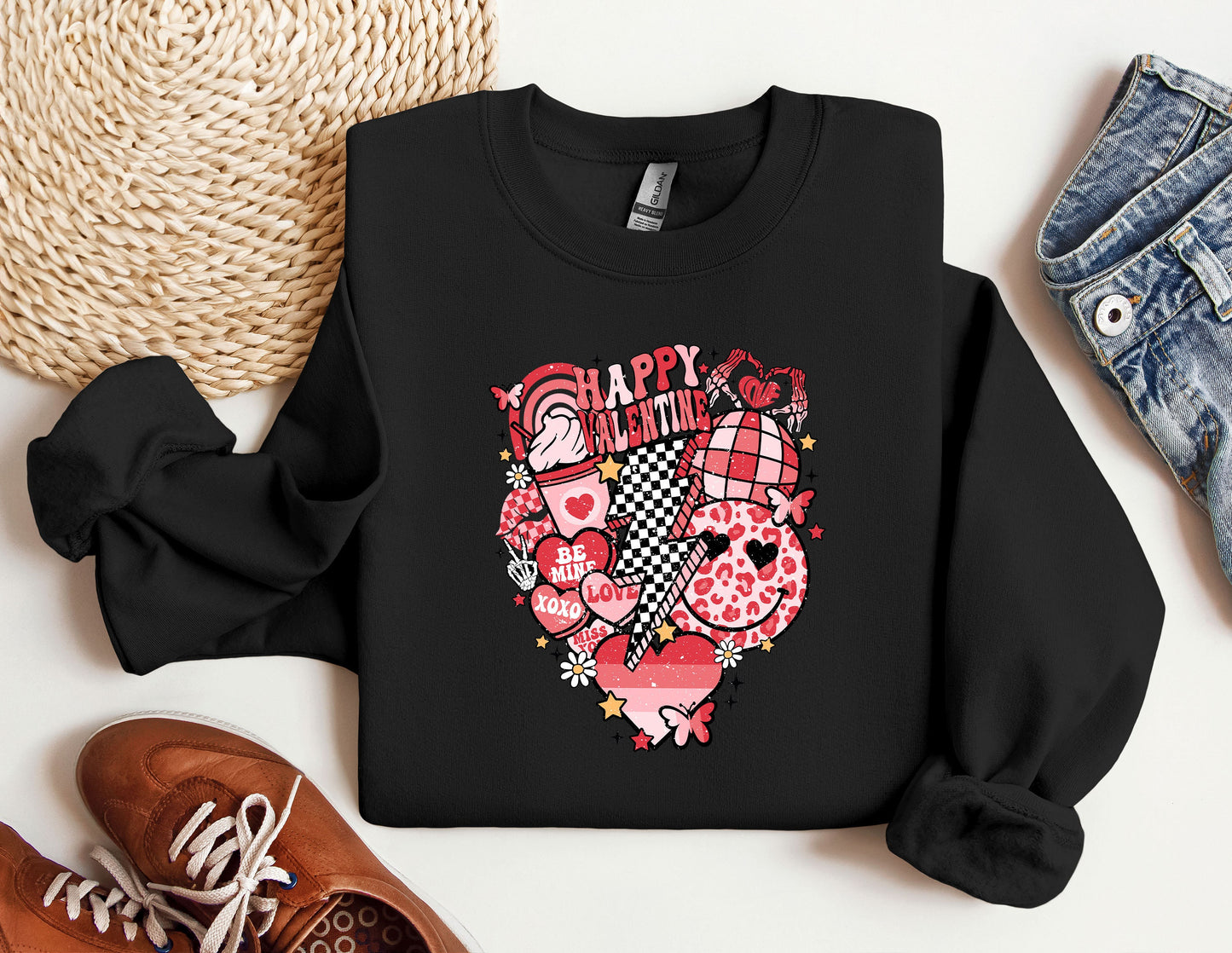 a black sweatshirt with a heart and flowers on it