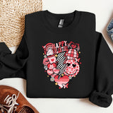 a black sweatshirt with a heart and flowers on it