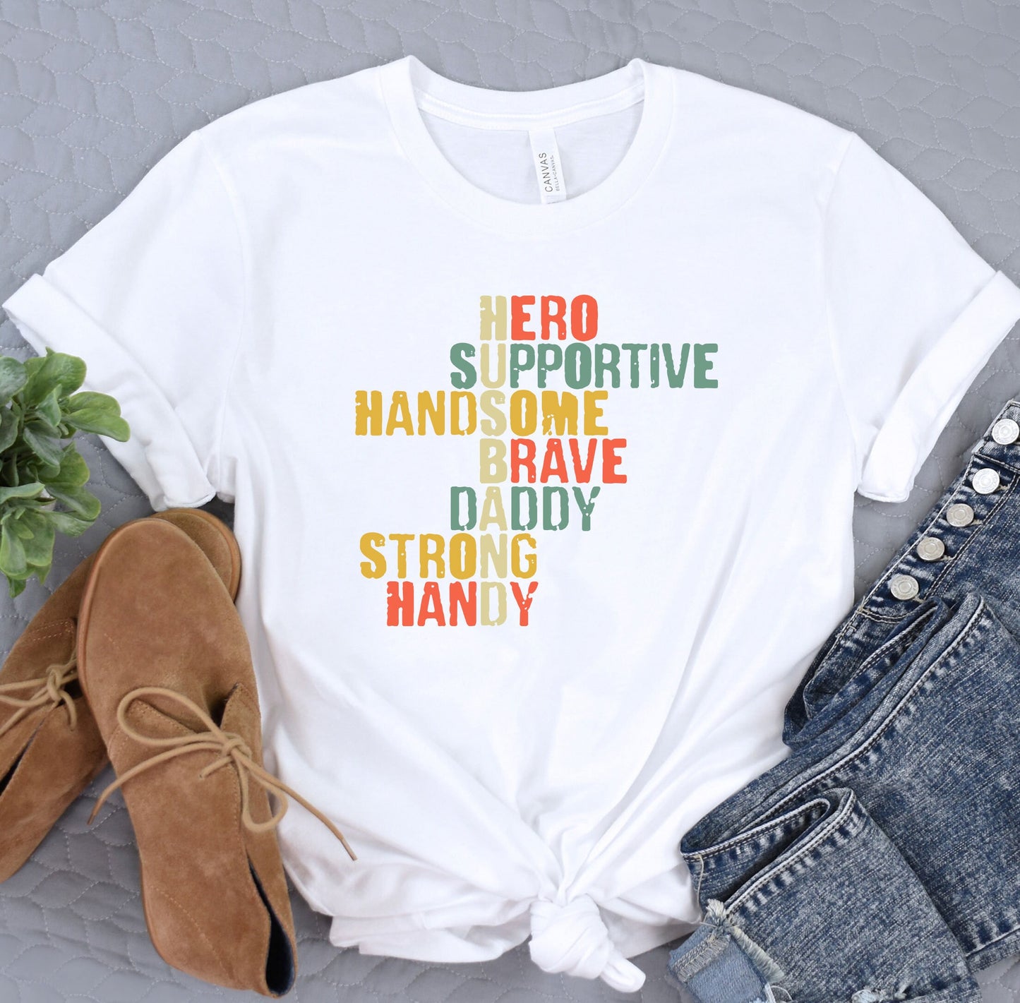 a t - shirt with the words hero, hand some brave, daddy, strong