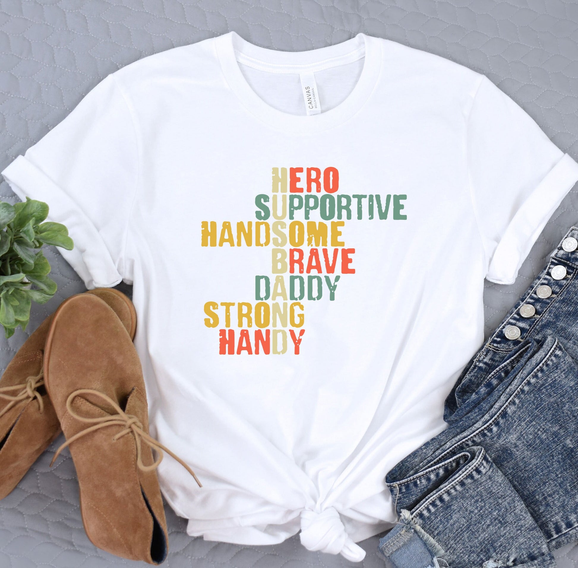 a t - shirt with the words hero, hand some brave, daddy, strong