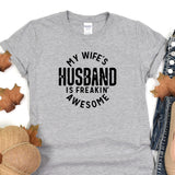 a t - shirt that says, my wife's husband is freakin '