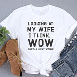 a t - shirt that says looking at my wife i think she's a