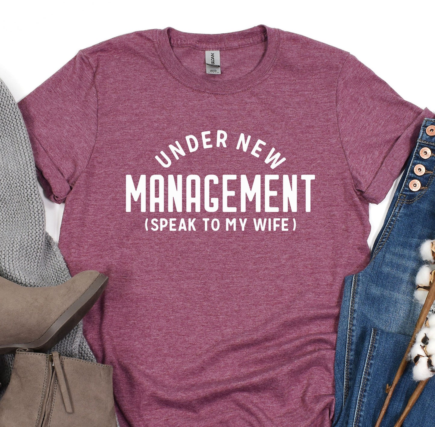 a t - shirt that says under new management speak to my wife