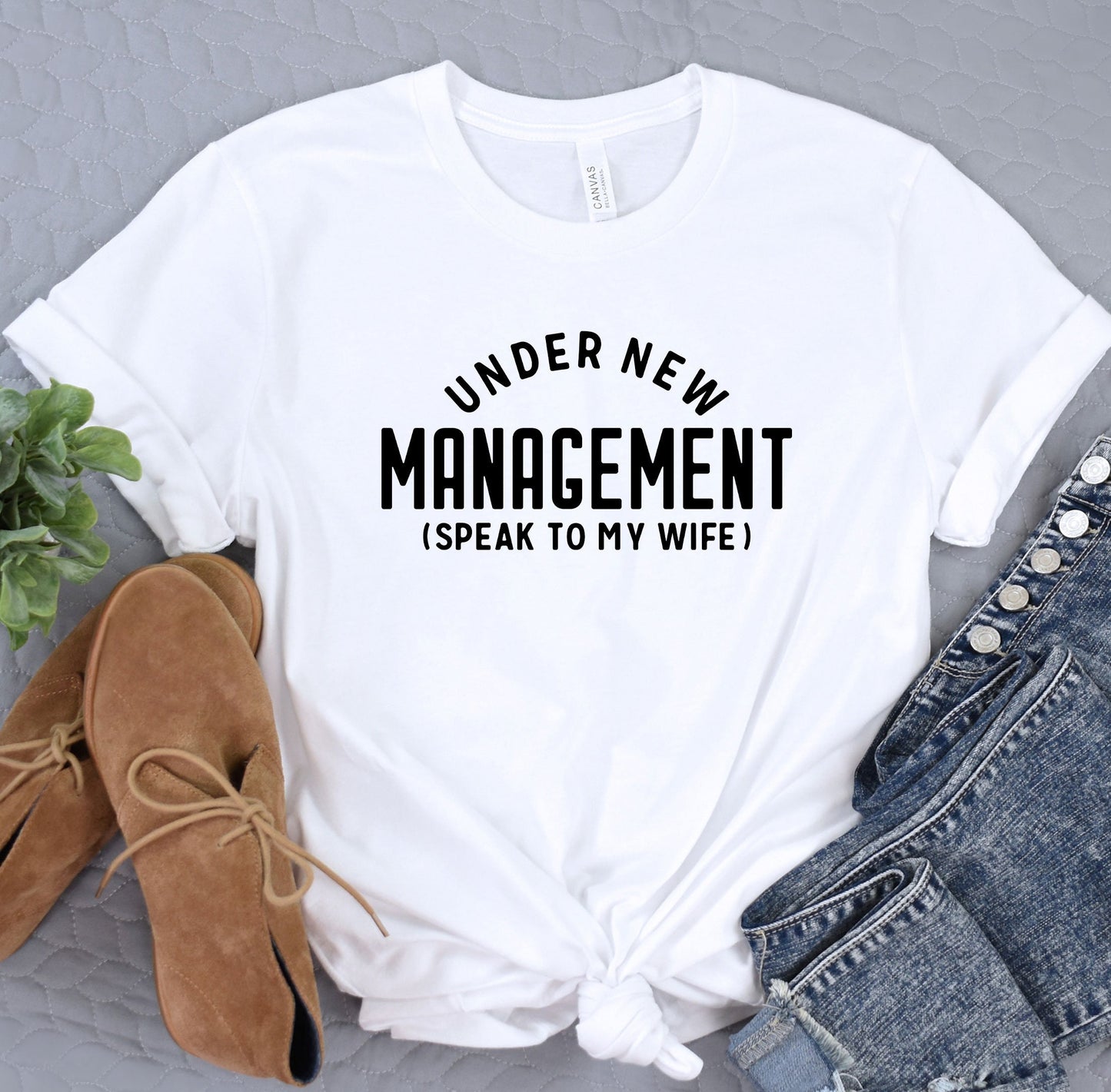 a t - shirt that says under new management is speak to my wife