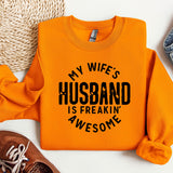 a sweater that says, my wife's husband is freakin'awesome