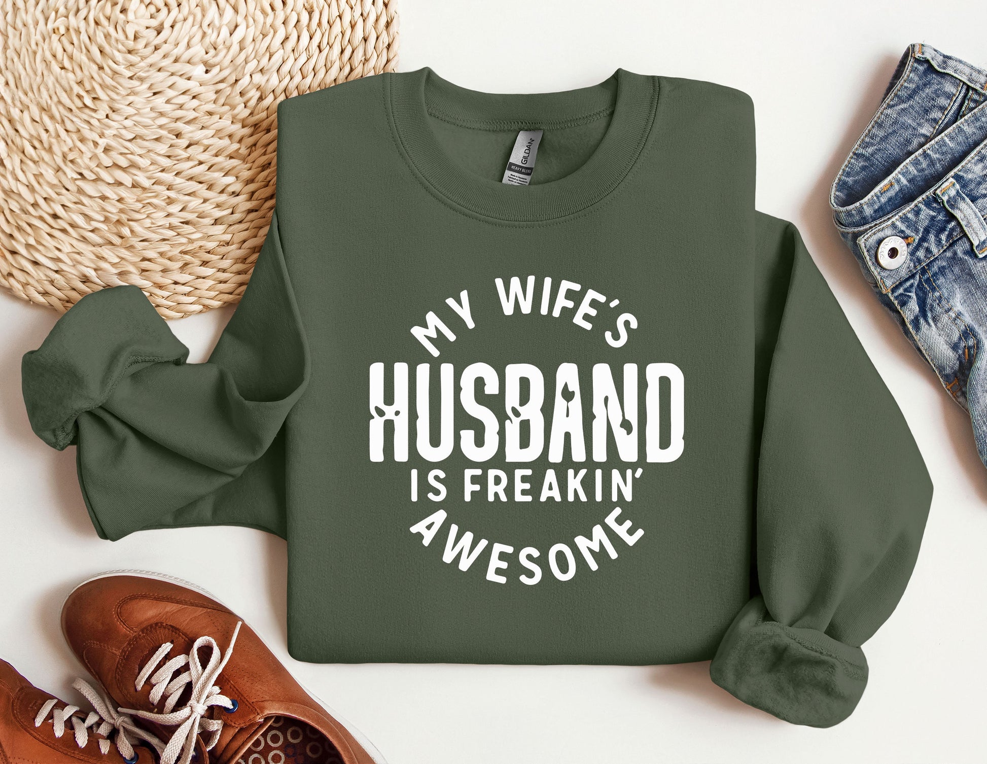 a sweatshirt that says, my wife&#39;s husband is freakin&#39;awesome