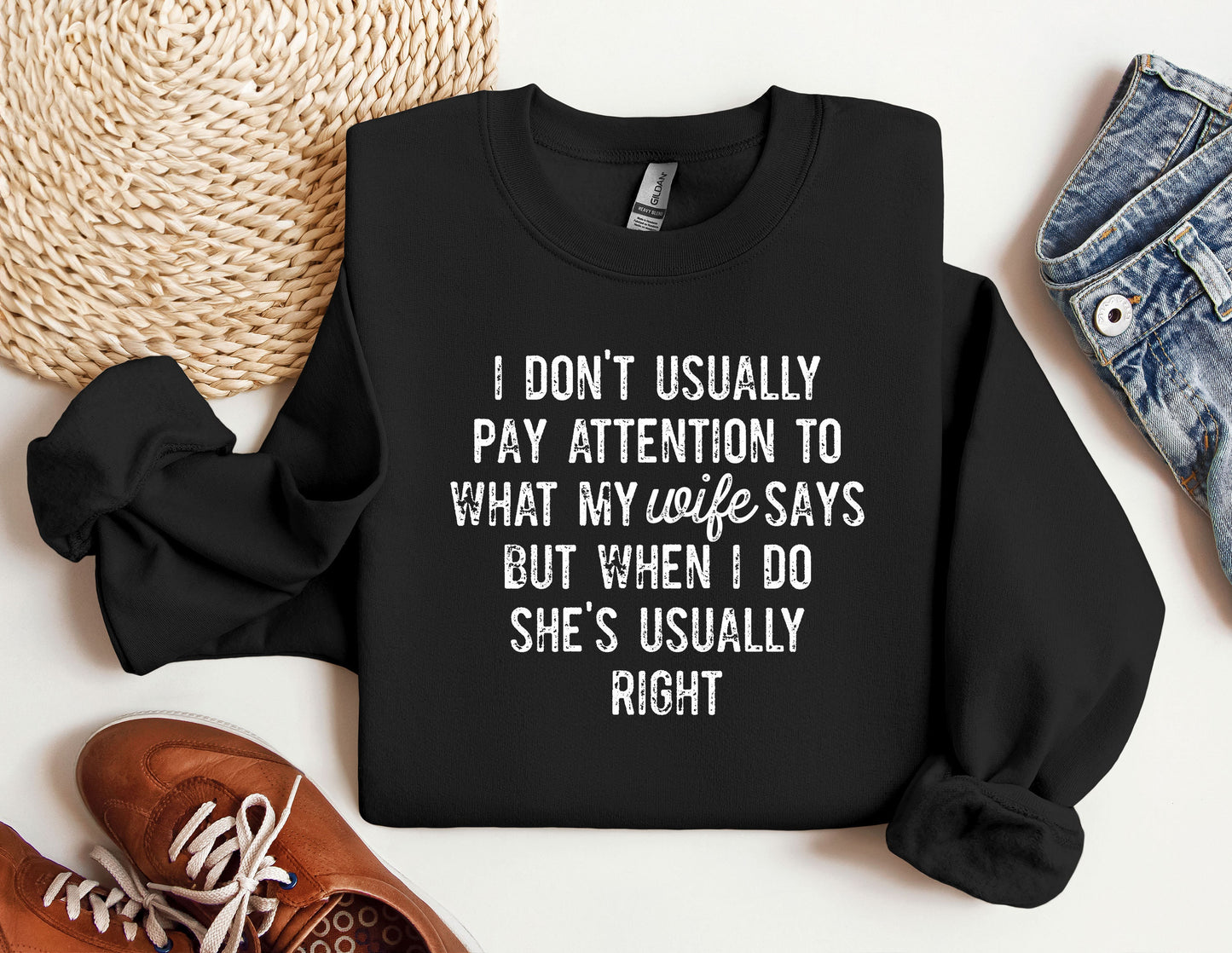 a black sweatshirt with a quote on it