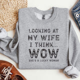 a sweater that says looking at my wife i think wow she's a lucky