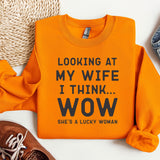 an orange sweater with a slogan on it