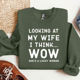 a sweatshirt that says looking at my wife i think she's a lucky woman