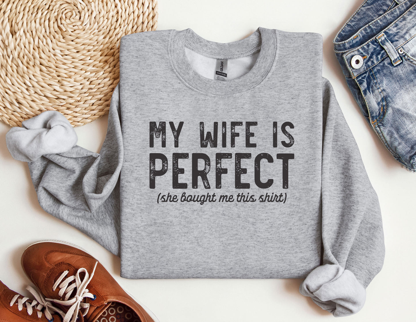 a sweater with the words my wife is perfect on it