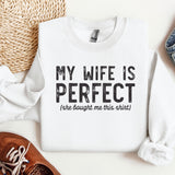 a white shirt that says, my wife is perfect she bought me this shirt