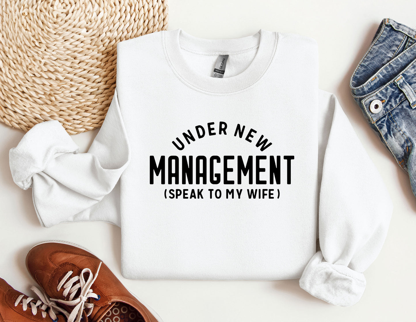 a sweater that says under new management i speak to my wife