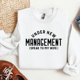 a sweater that says under new management i speak to my wife