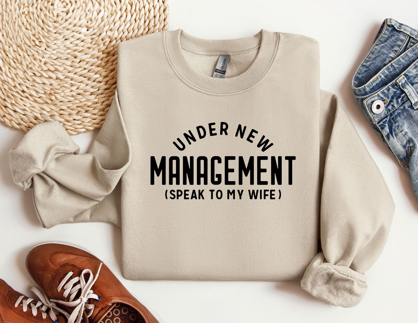 a sweater that says under new management i speak to my wife