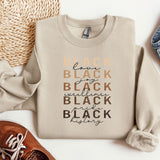 a pair of shoes, a sweater, and a pair of jeans on a white