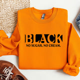 a pair of shoes and an orange sweatshirt with the words black, no sugar,