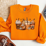 a pair of sneakers and an orange sweatshirt with a picture of two cups of coffee