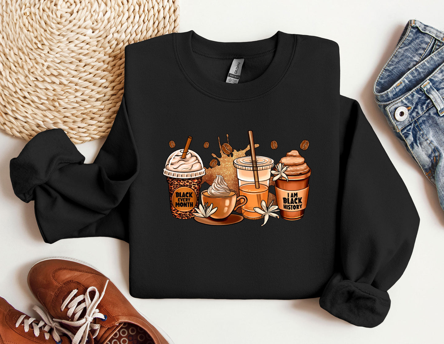 a black sweatshirt with a picture of coffee and ice cream