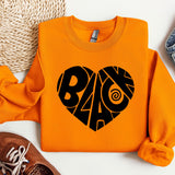 a pair of shoes and a sweatshirt with the word love on it