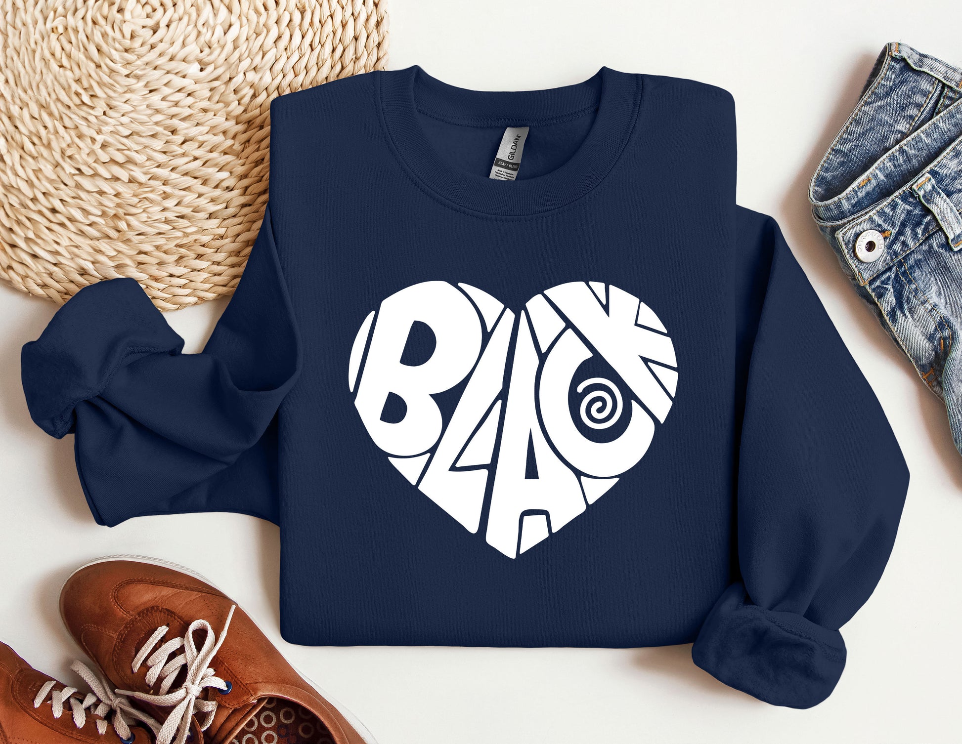 a blue sweatshirt with a white heart on it