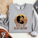 a sweatshirt with a picture of a woman's face and the words built by