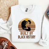 a white shirt with a picture of a woman and a crown on it
