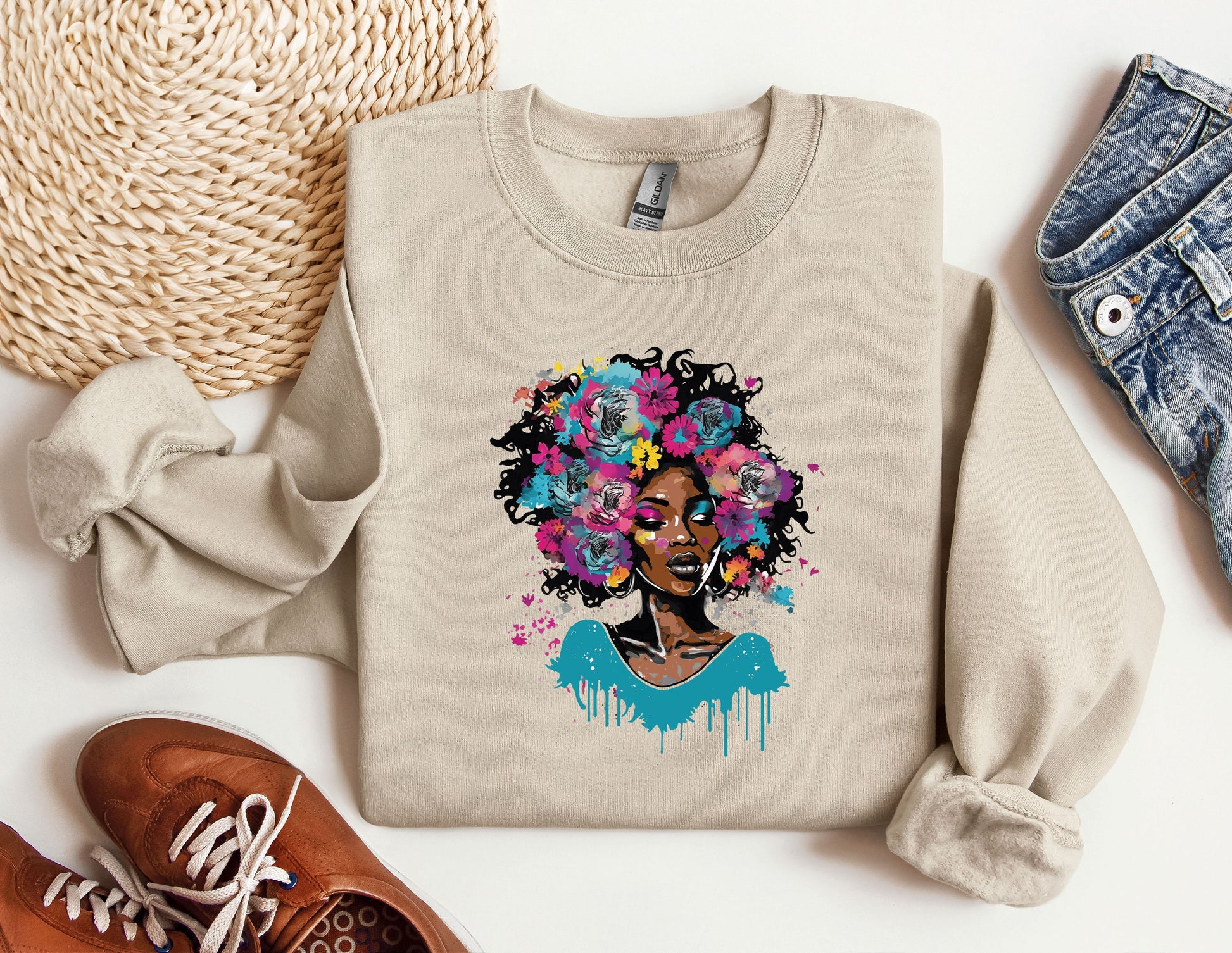 a sweater with a picture of a woman with flowers on it