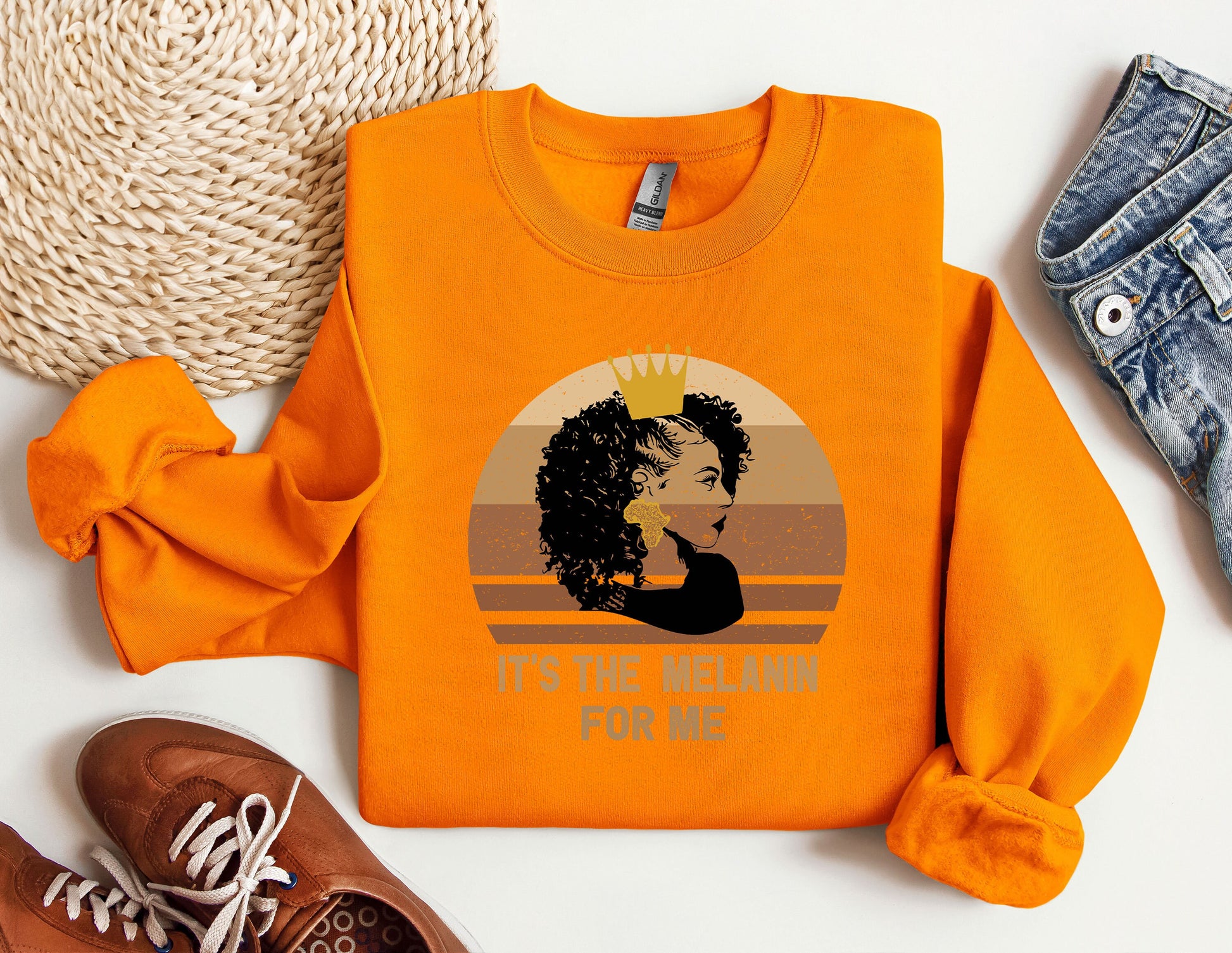 an orange shirt with a picture of a woman with a crown on it