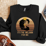 a black shirt with a picture of a woman wearing a crown