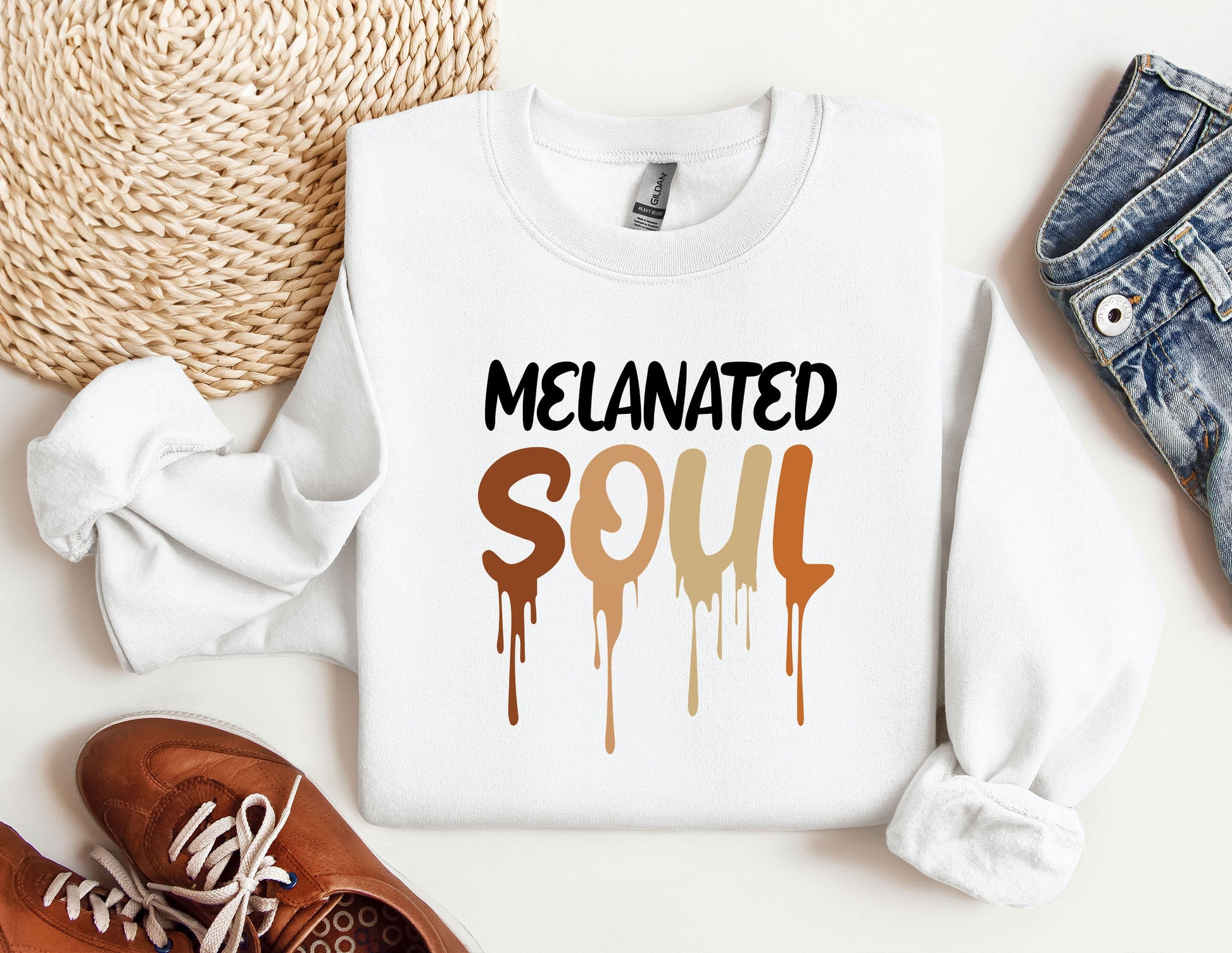 a white sweatshirt with the words melanited soul painted on it