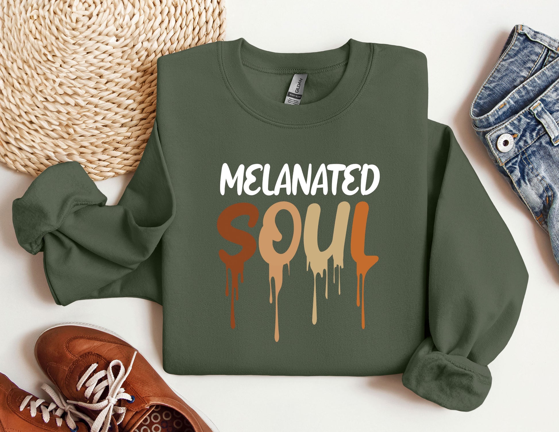 a green sweatshirt with the words melanited soul on it